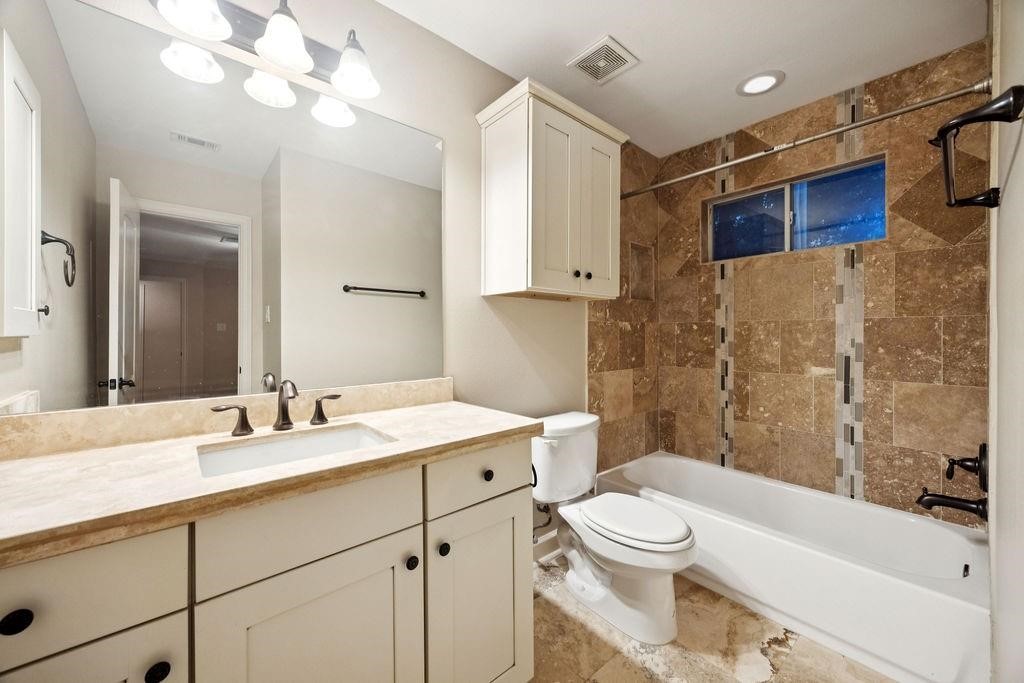 5407 Lillian Street Houston, TX 77007 - Photo 25 of 38 a bathroom with a sink a toilet and shower