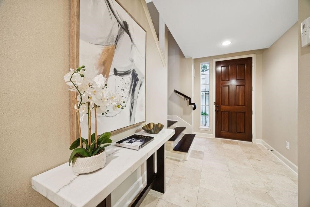 5407 Lillian Street Houston, TX 77007 - Photo 4 of 38 a living room with a table chairs and entryway