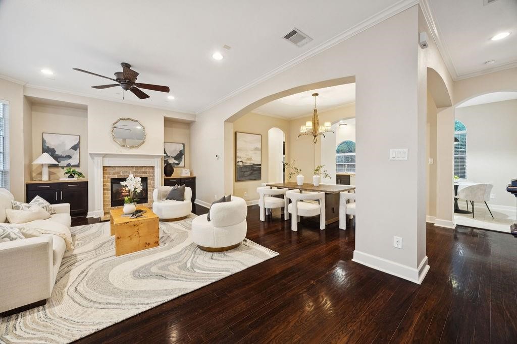 5407 Lillian Street Houston, TX 77007 - Photo 7 of 38 a view of a dining room with furniture a chandelier and wooden floor
