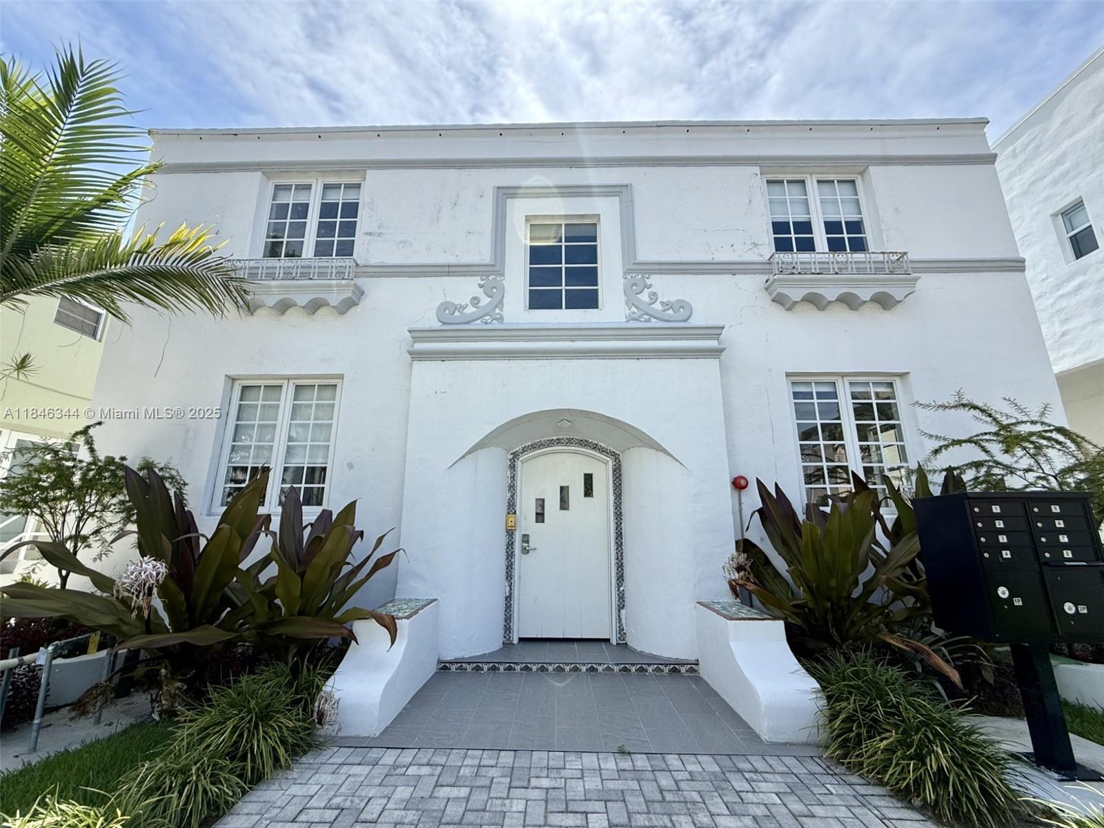 1552 Euclid Avenue, Unit 3 Miami Beach, FL 33139 - Photo 11 of 13 a front view of a house with garden