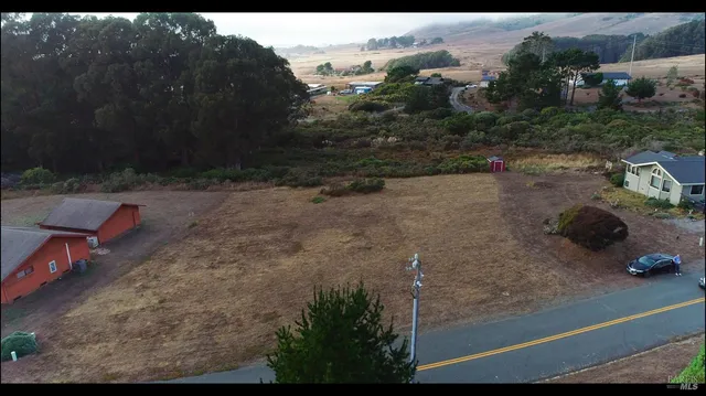 a view of a backyard of a house