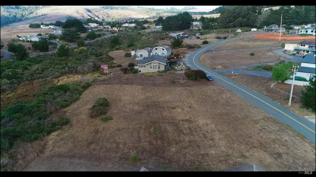 a view of a backyard with outdoor space