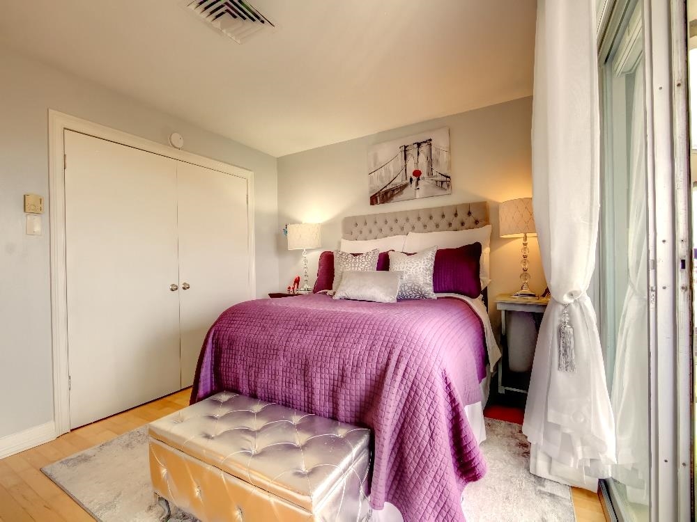 655 Riverside Drive, Unit 805A Memphis, TN 38103 - Photo 12 of 25 a bedroom with a bed and a window