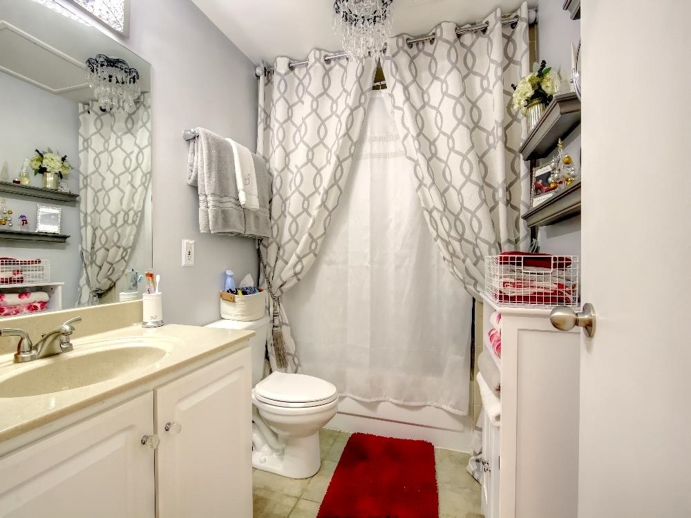 655 Riverside Drive, Unit 805A Memphis, TN 38103 - Photo 13 of 25 a bathroom with a sink toilet and shower