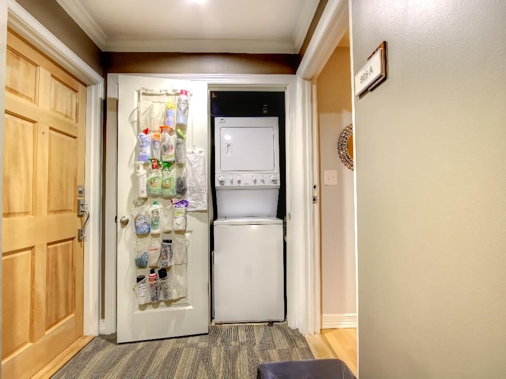 655 Riverside Drive, Unit 805A Memphis, TN 38103 - Photo 15 of 25 a view of a hallway with wooden floor and dining room