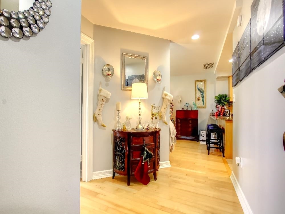 655 Riverside Drive, Unit 805A Memphis, TN 38103 - Photo 4 of 25 a view of living room with furniture and a chandelier