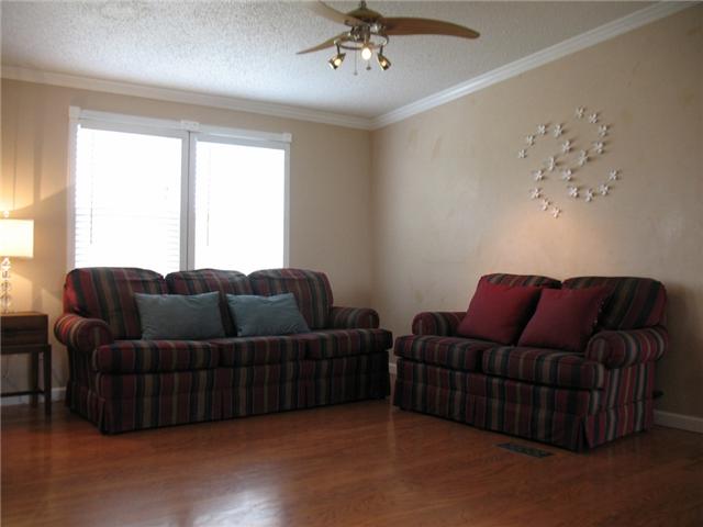 3174 Beckwith Road Mount Juliet, TN 37122 - Photo 3 of 15 a living room with couches and a chandelier
