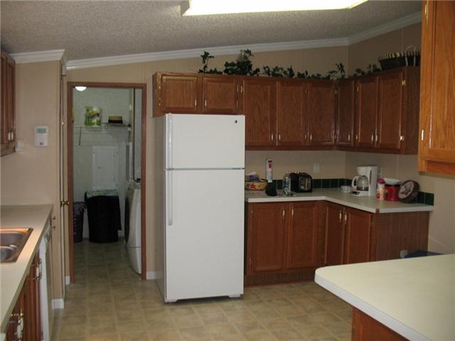 3174 Beckwith Road Mount Juliet, TN 37122 - Photo 7 of 15 a kitchen with a refrigerator a stove and cabinets