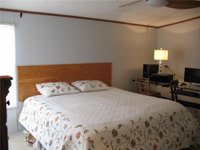 3174 Beckwith Road Mount Juliet, TN 37122 - Photo 8 of 15 a bedroom with a bed and chair