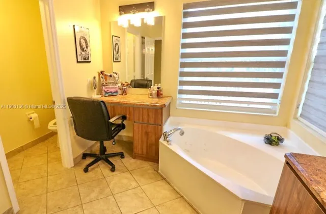 a bathroom with a bathtub and a sink