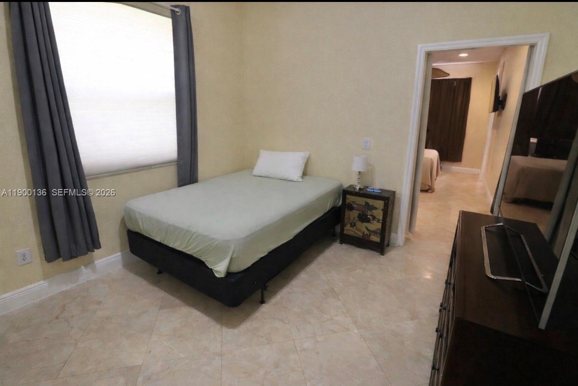 4591 Southwest 131st Terrace Miramar, FL 33027 - Photo 26 of 31 Downstairs Bedroom