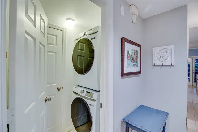 a view of a hallway with washer and dryer