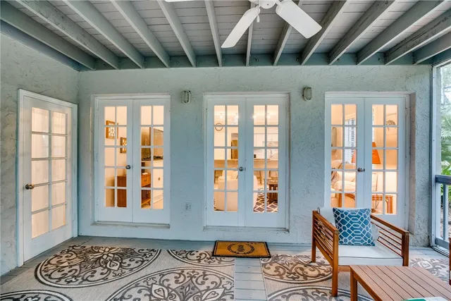 a view of an entryway with wooden floor