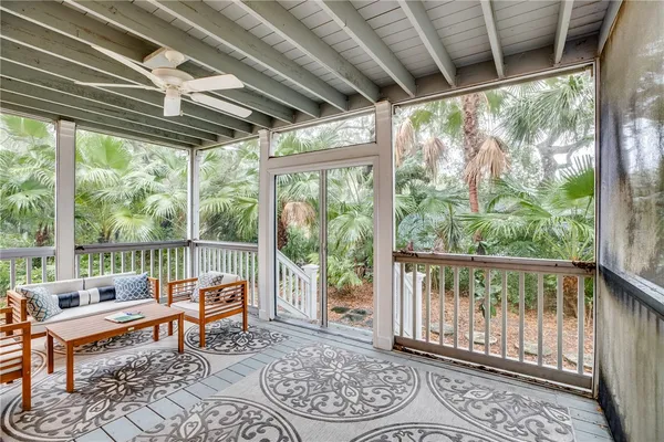 a balcony with furniture and wooden deck