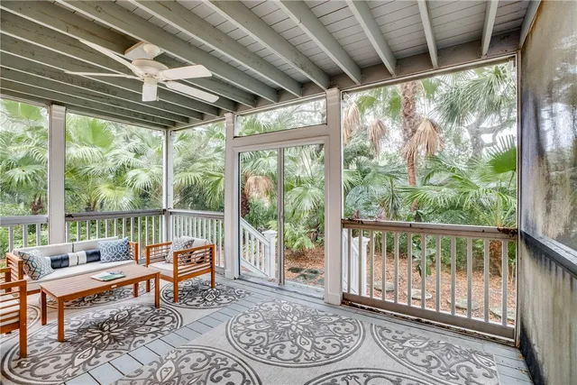 a balcony with furniture and wooden deck