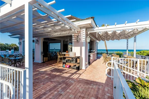 a view of a patio with a table chairs and a patio
