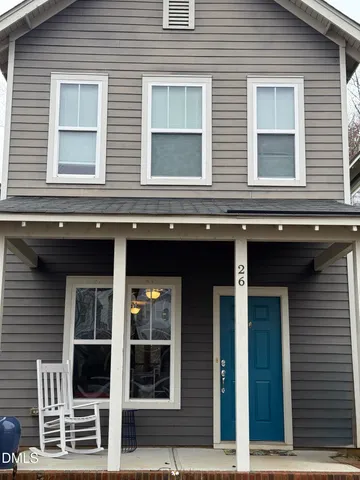 a view of brick building with large windows