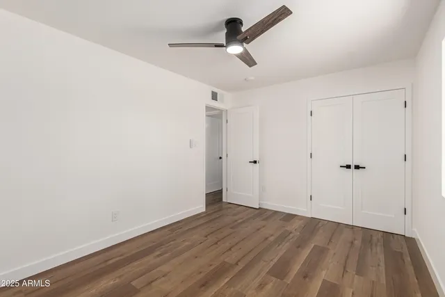 a view of room with hardwood floor