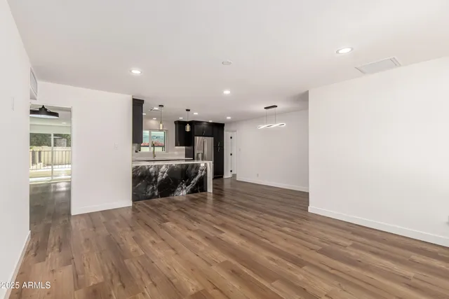 a view of kitchen with furniture and wooden floor