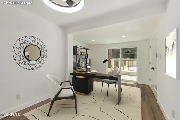 a view of a workspace with furniture