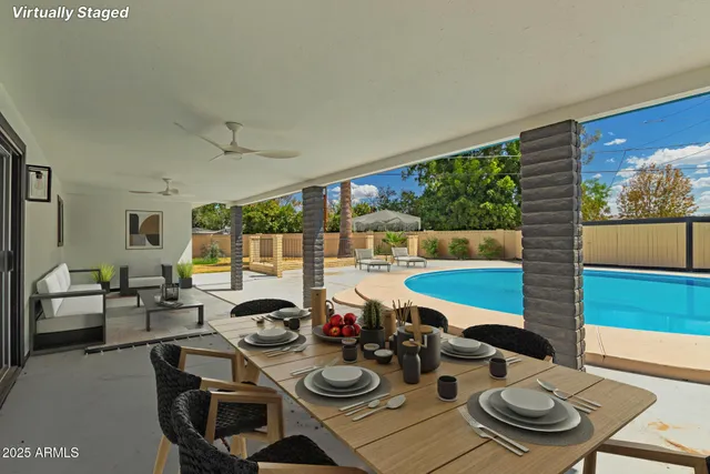 a room with furniture and a floor to ceiling window