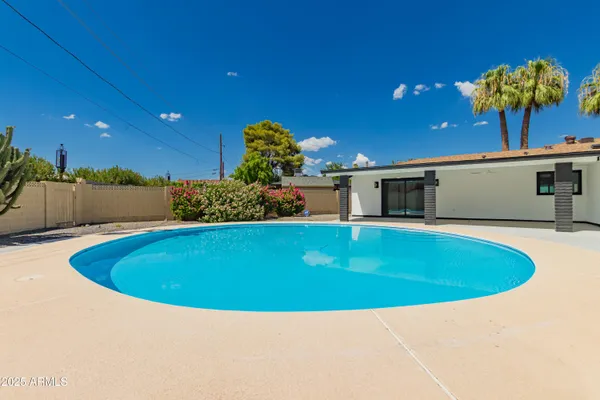 a view of outdoor space and swimming pool