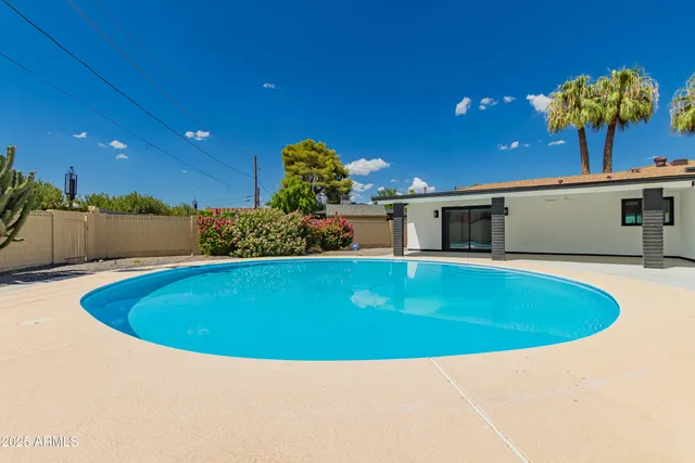 a view of outdoor space and swimming pool