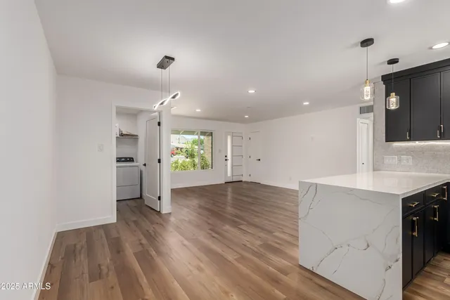 a view of a kitchen with a sink and a stove top oven