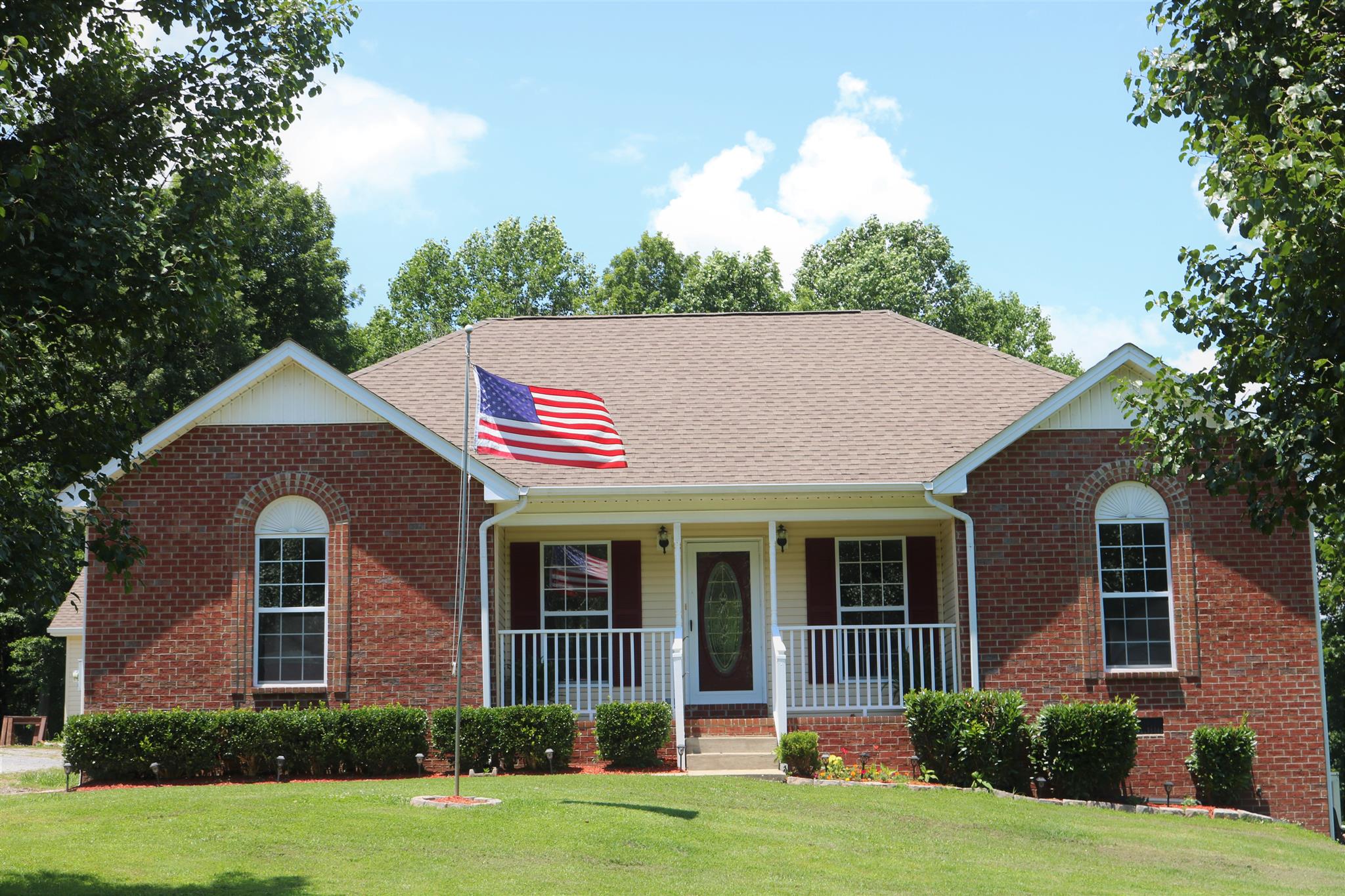 1525 Rapids Road Portland, TN 37148 - Photo 1 of 14 front view of a house with a yard