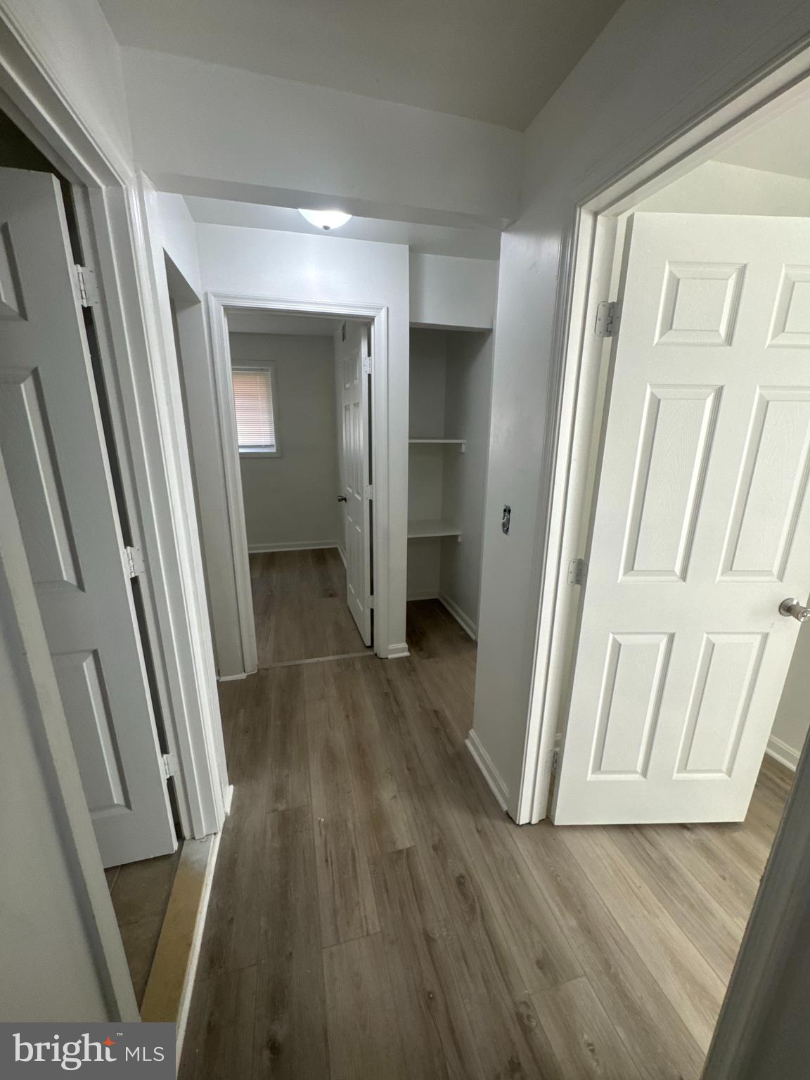 3930 1st Street Southeast, Unit 301 Washington, DC 20032 - Photo 2 of 9 a view of a hallway with wooden floor and staircase
