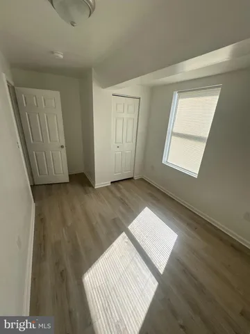 a view of an empty room and glass door