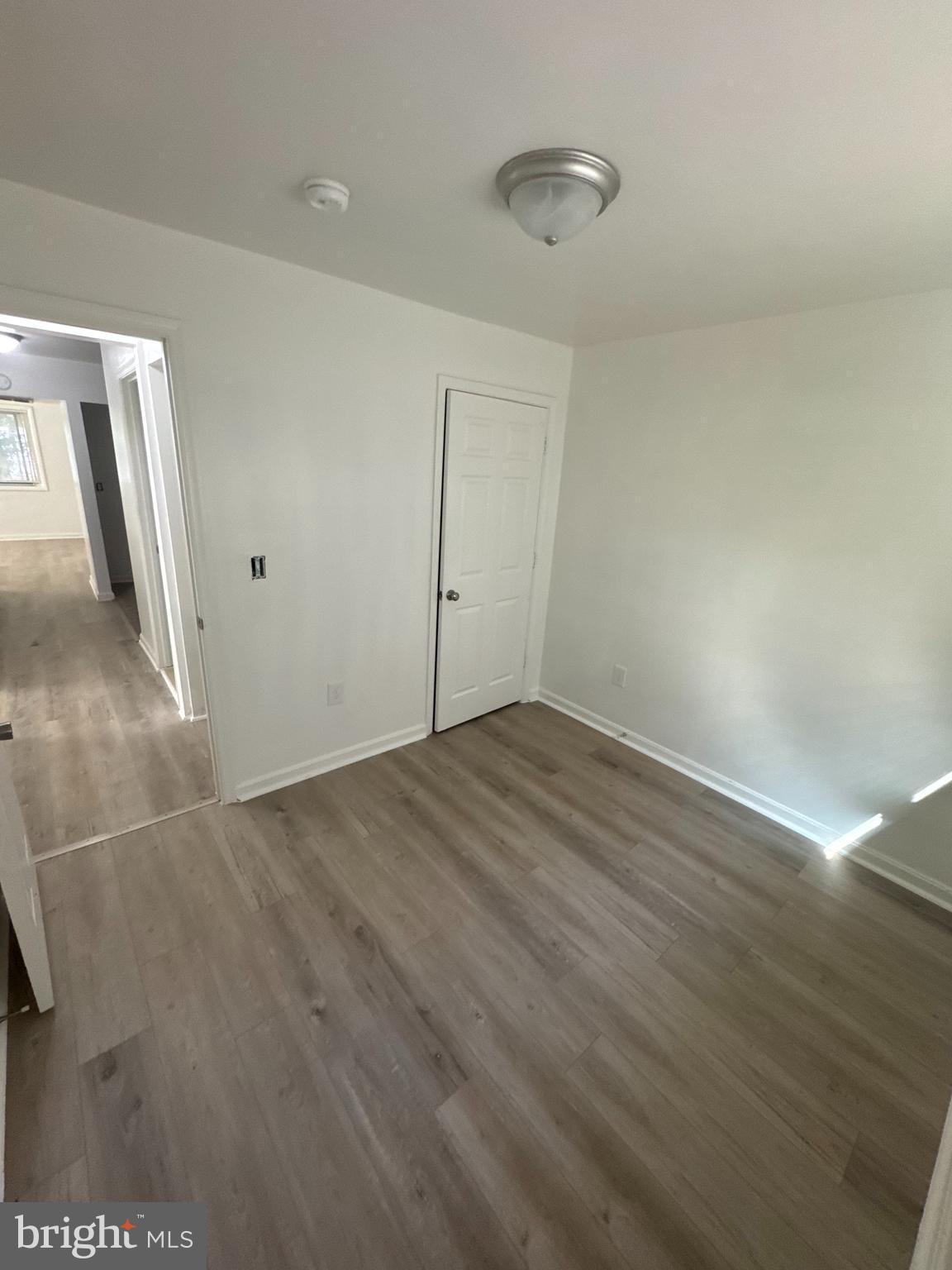 3930 1st Street Southeast, Unit 301 Washington, DC 20032 - Photo 6 of 9 wooden floor in an empty room