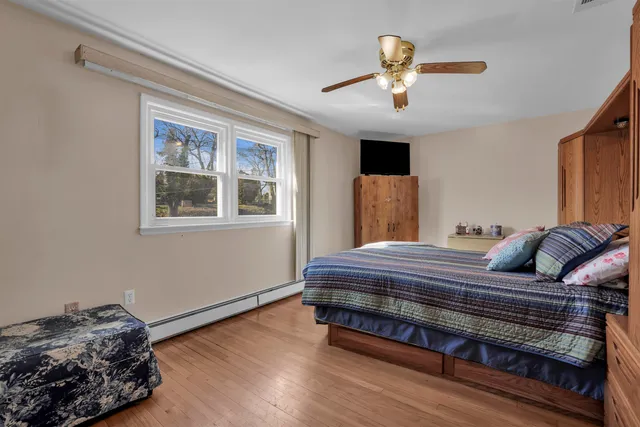 a bedroom with bed and window