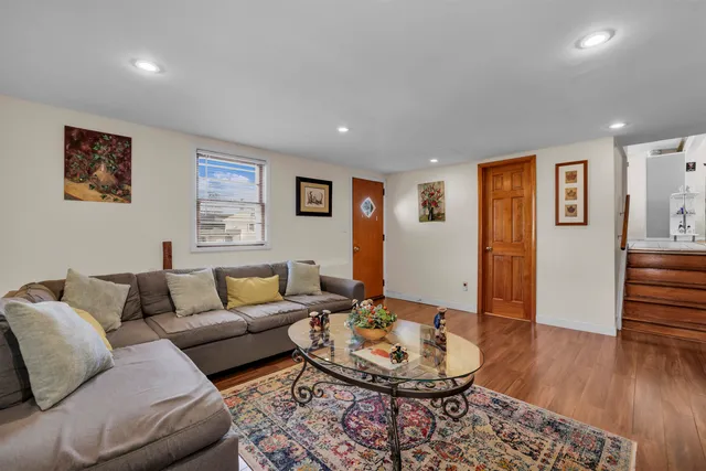 a spacious bedroom with a bed and a large window