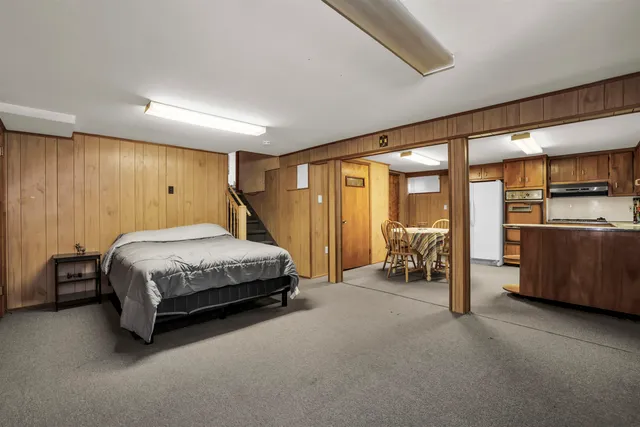 a bedroom with a bed and a shower