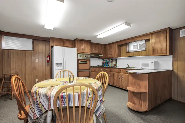 a bedroom with a bed and a table