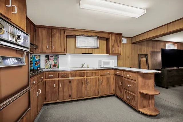 a bathroom with a toilet a sink and a shower