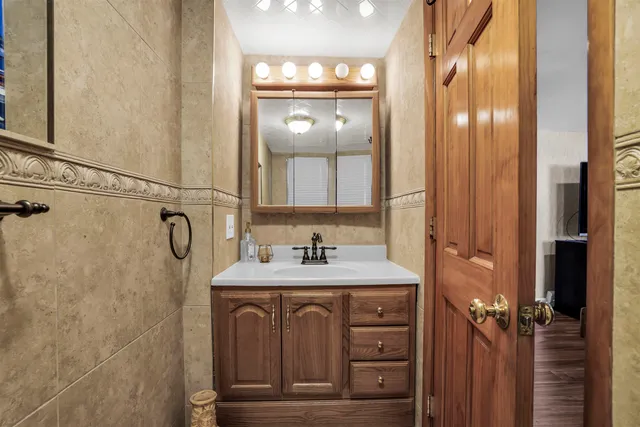 a utility room with cabinets washer and dryer