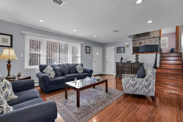 a kitchen with a sink stainless steel appliances cabinets and a counter top space