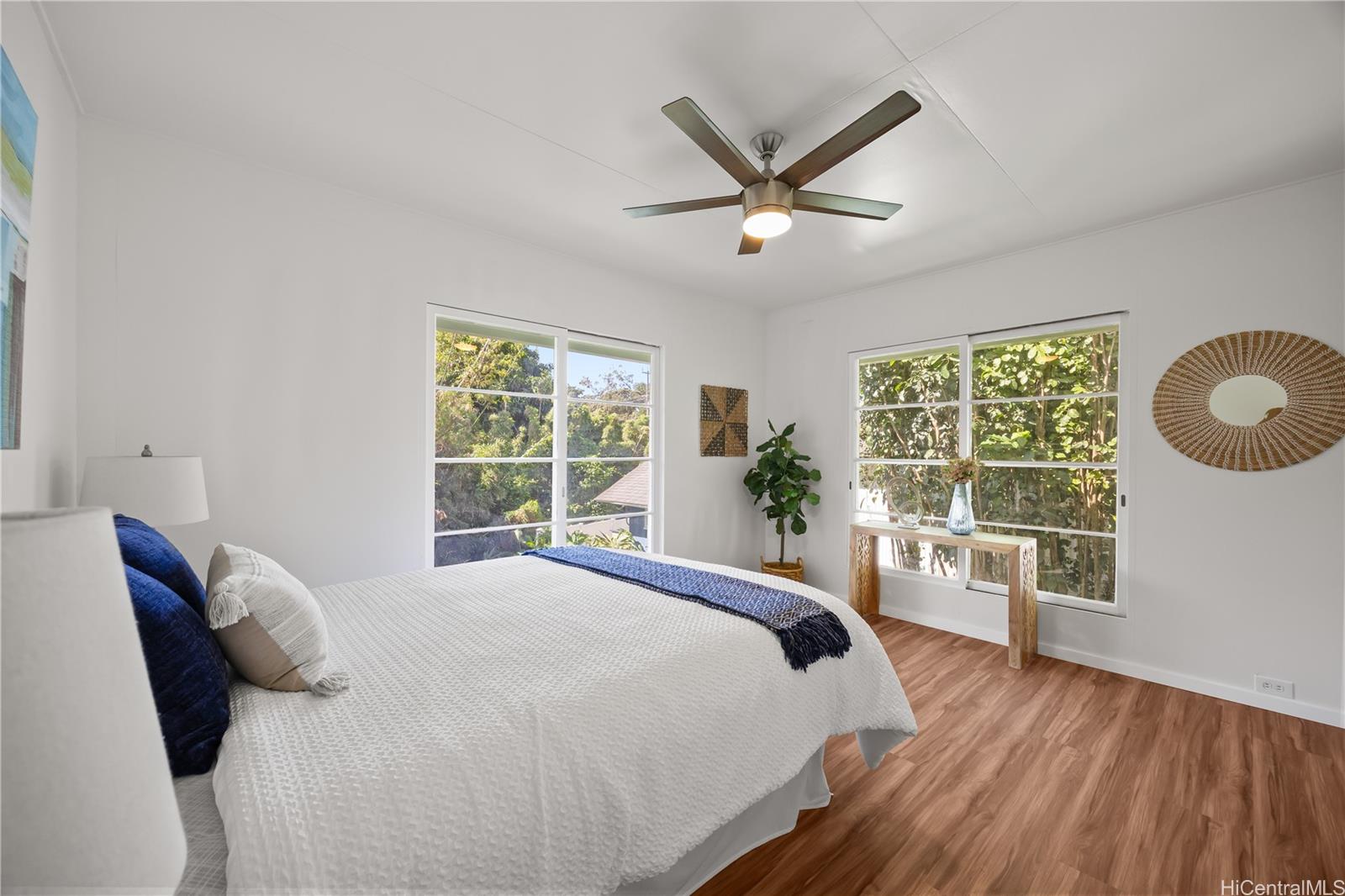 19 Hinalo Place Honolulu, HI 96817 - Photo 11 of 25 a bedroom with a large bed and a large window