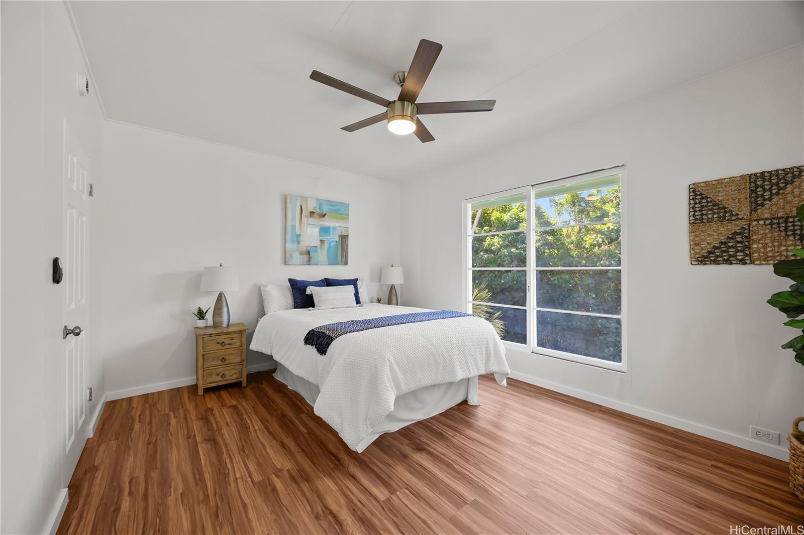 19 Hinalo Place Honolulu, HI 96817 - Photo 12 of 25 a spacious bedroom with a bed and wooden floor