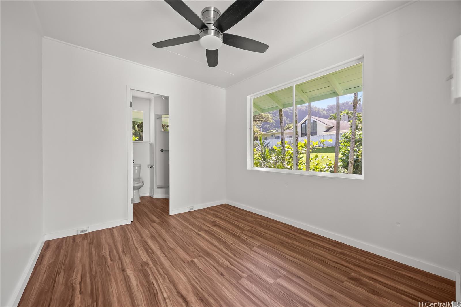 19 Hinalo Place Honolulu, HI 96817 - Photo 16 of 25 wooden floor in an empty room with a window