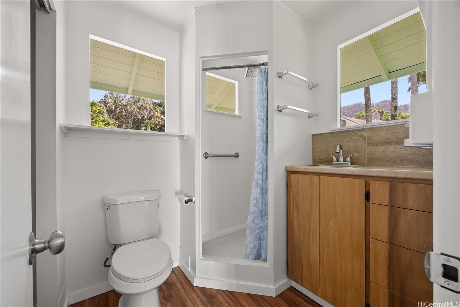 19 Hinalo Place Honolulu, HI 96817 - Photo 17 of 25 a bathroom with a granite countertop sink toilet and shower