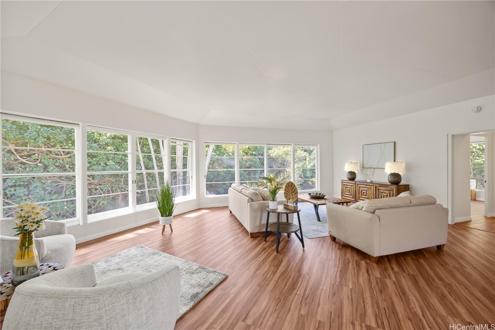 19 Hinalo Place Honolulu, HI 96817 - Photo 5 of 25 a living room with furniture and floor to ceiling windows