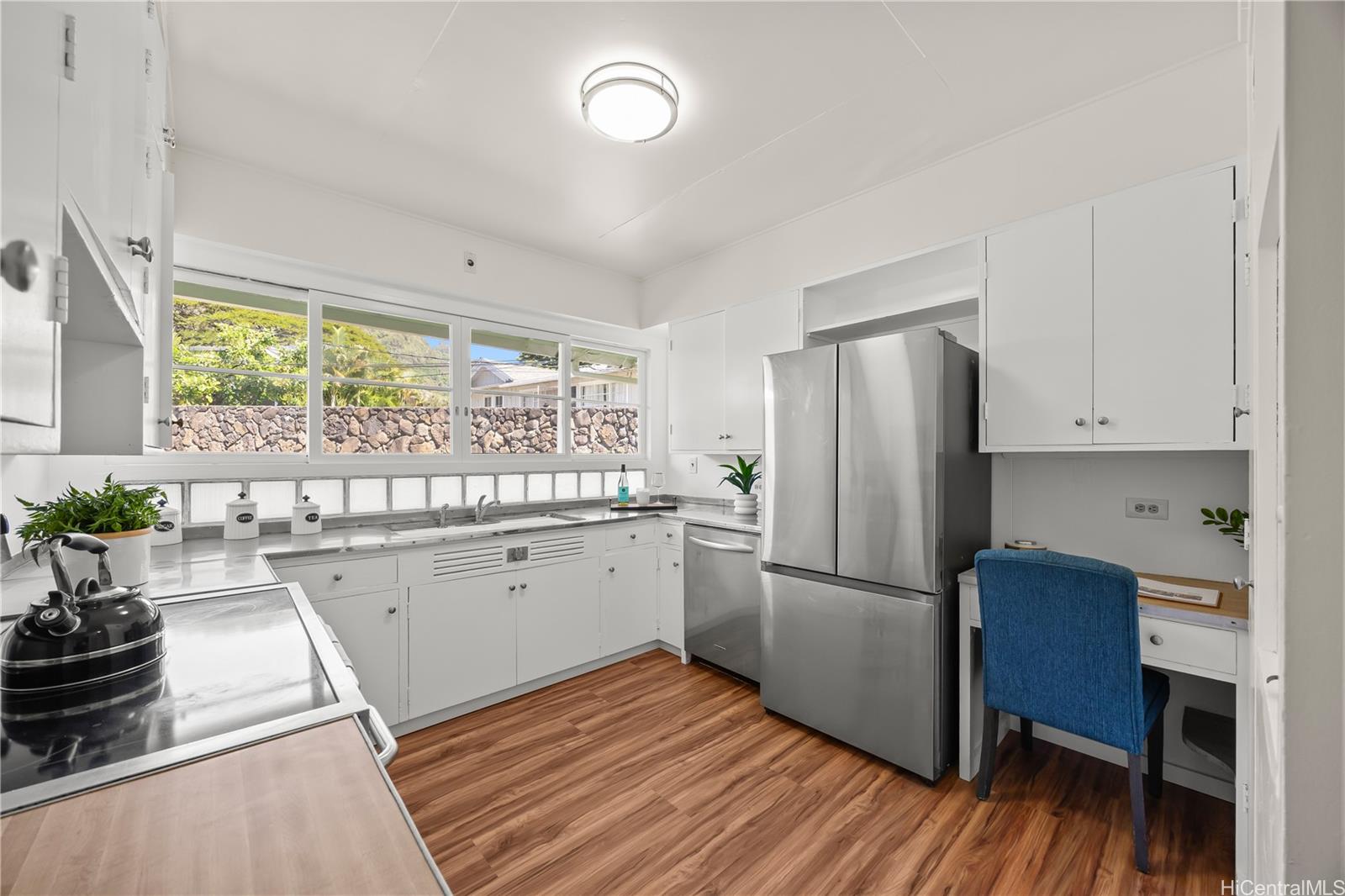 19 Hinalo Place Honolulu, HI 96817 - Photo 6 of 25 a kitchen with a refrigerator and wooden floor