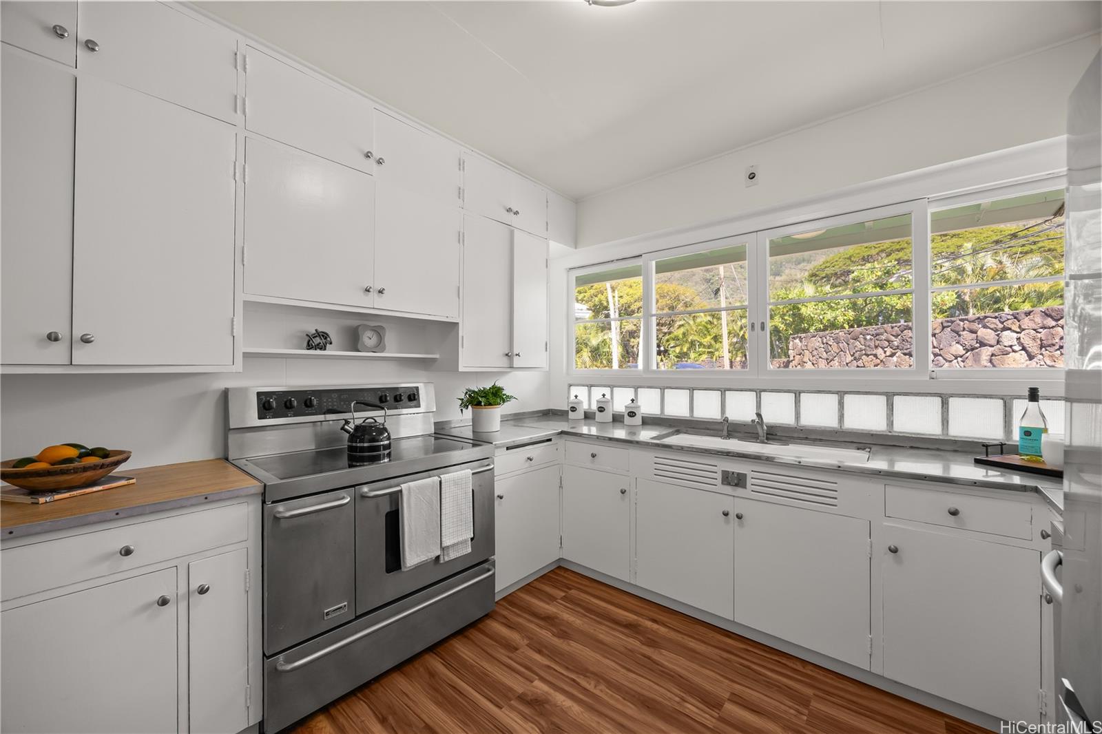 19 Hinalo Place Honolulu, HI 96817 - Photo 7 of 25 a kitchen with a sink stove top oven and cabinets