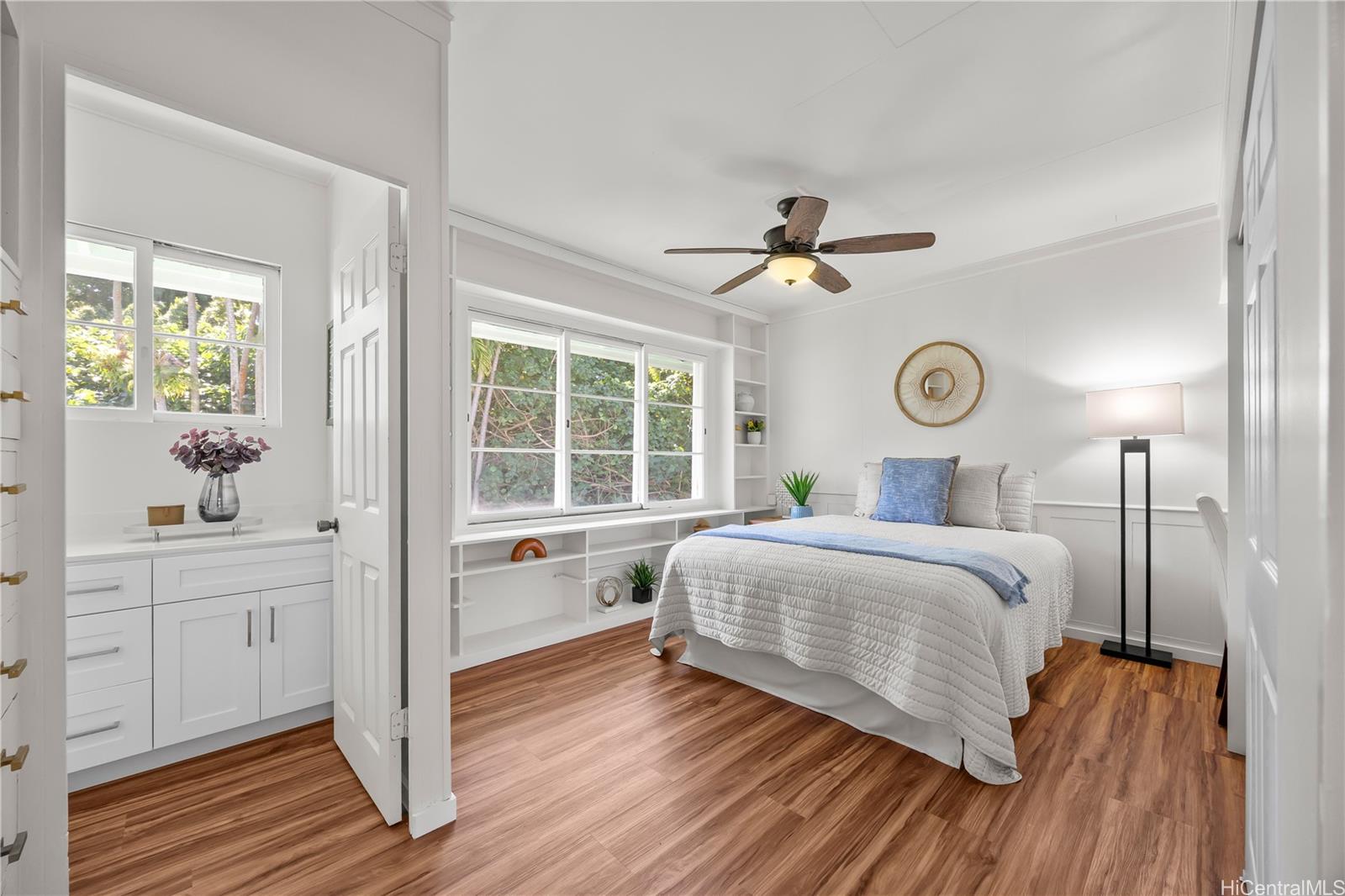 19 Hinalo Place Honolulu, HI 96817 - Photo 8 of 25 a bedroom with a bed and a large window with wooden floor