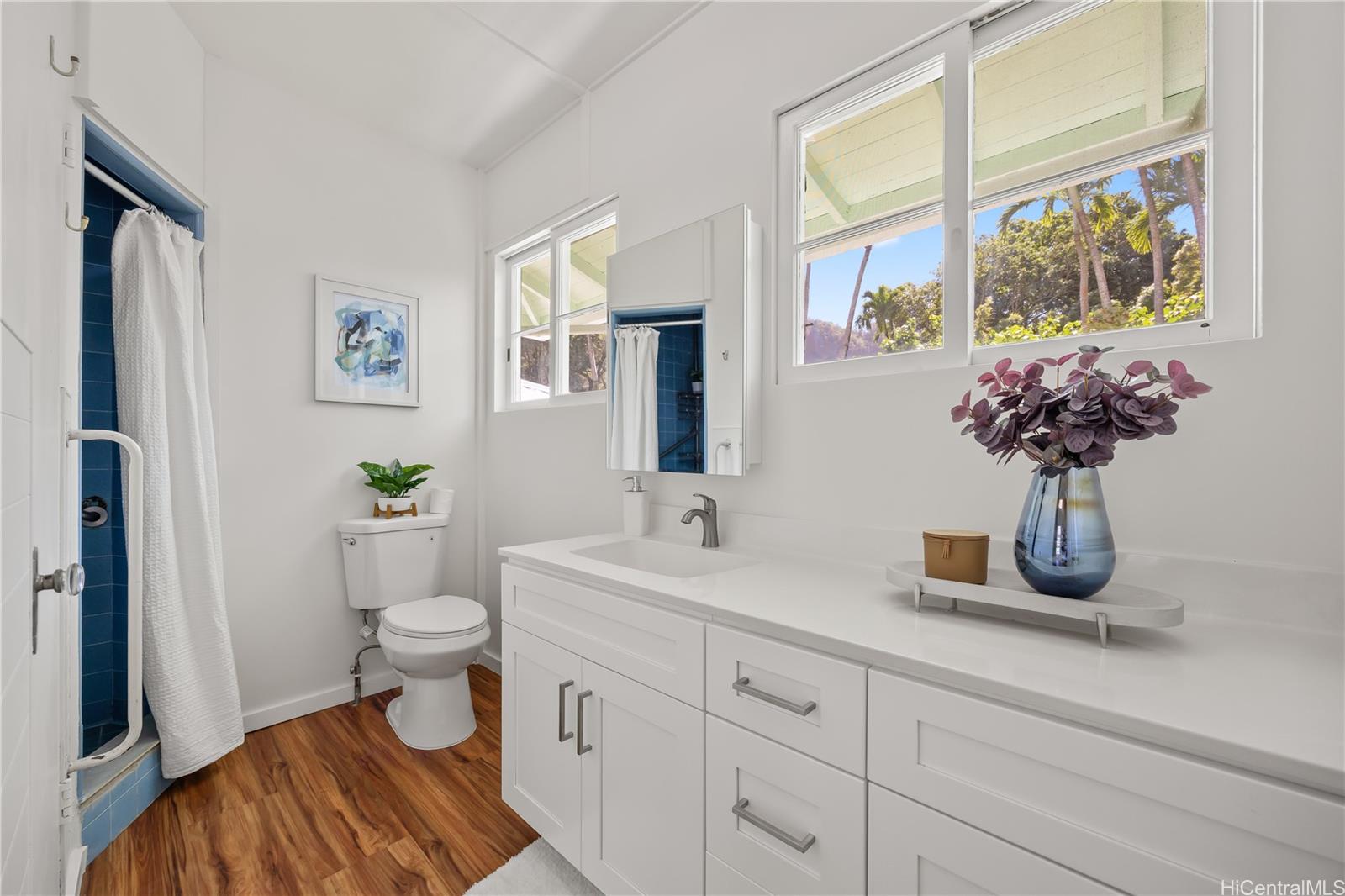 19 Hinalo Place Honolulu, HI 96817 - Photo 10 of 25 a bathroom with a sink a toilet and a window