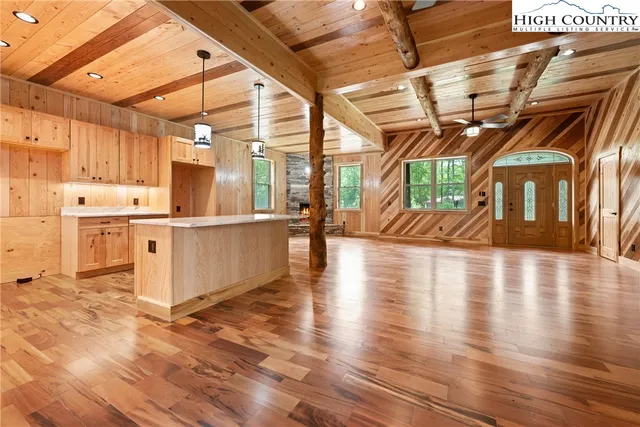 a view of a living room with wooden floor