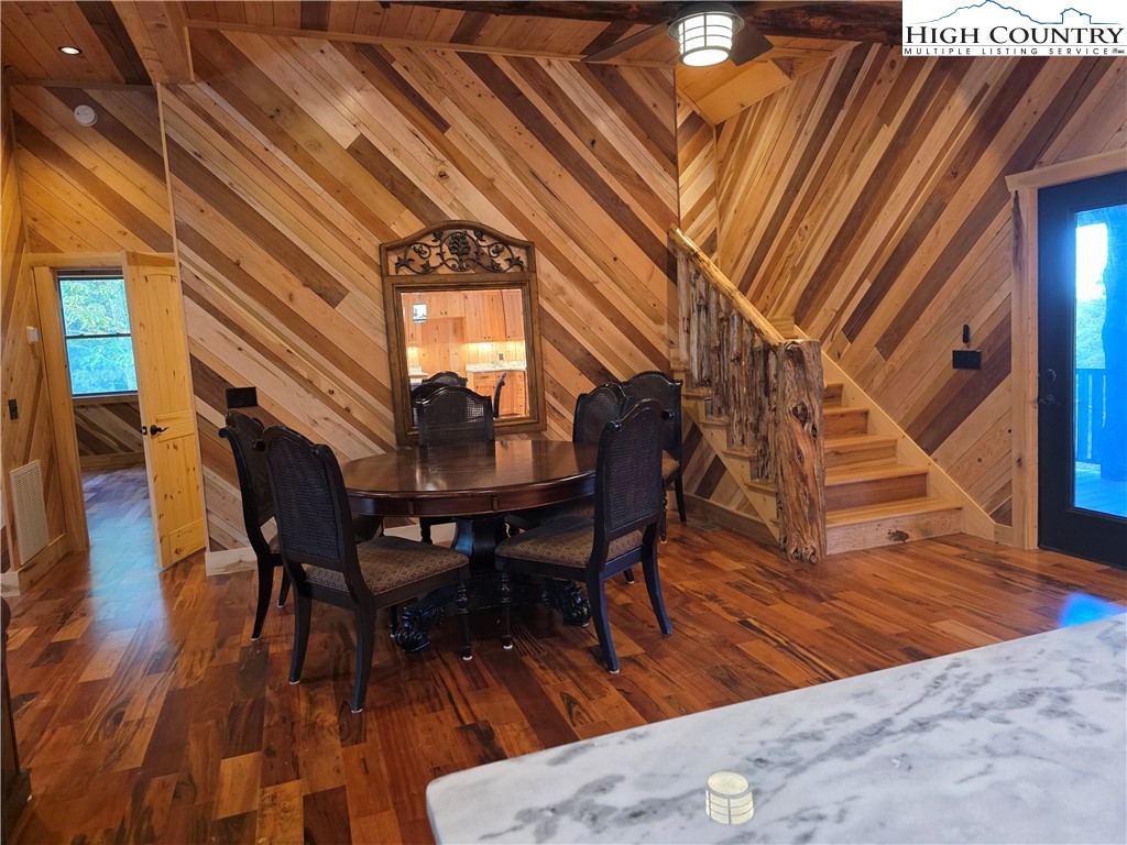 449 Hampton Ridge Road Fleetwood, NC 28626 - Photo 21 of 43 a workspace with wooden floor and furniture